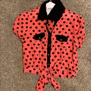 Reddish-orange and black crop top